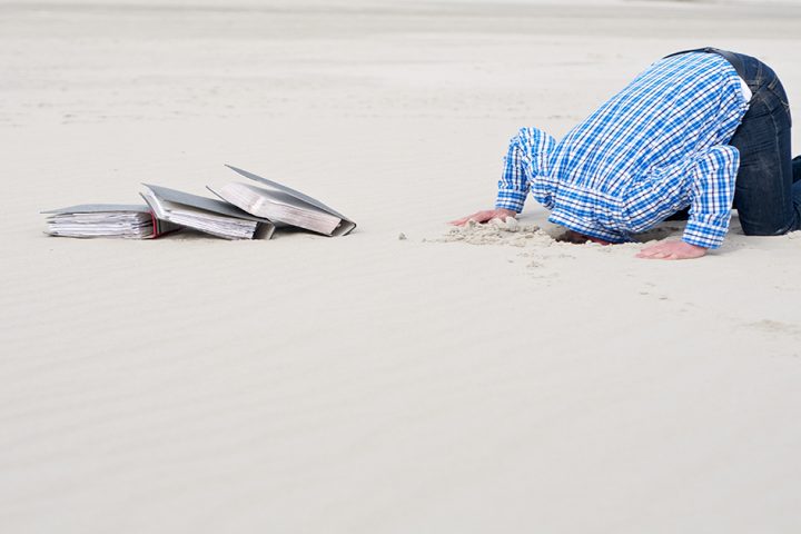 office-worker-hiding-head-in-sand-2